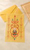 Digital mockup of Pig Guardian Bujeok artwork on a yellow hanji sheet with illustrative packaging; finished print and packaging may differ — Obang House