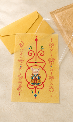 Digital mockup of Pig Guardian Bujeok artwork on a yellow hanji sheet with illustrative packaging; finished print and packaging may differ — Obang House